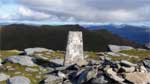 Trig point on Beinn Cheathiach with Sgiath Chuil behind